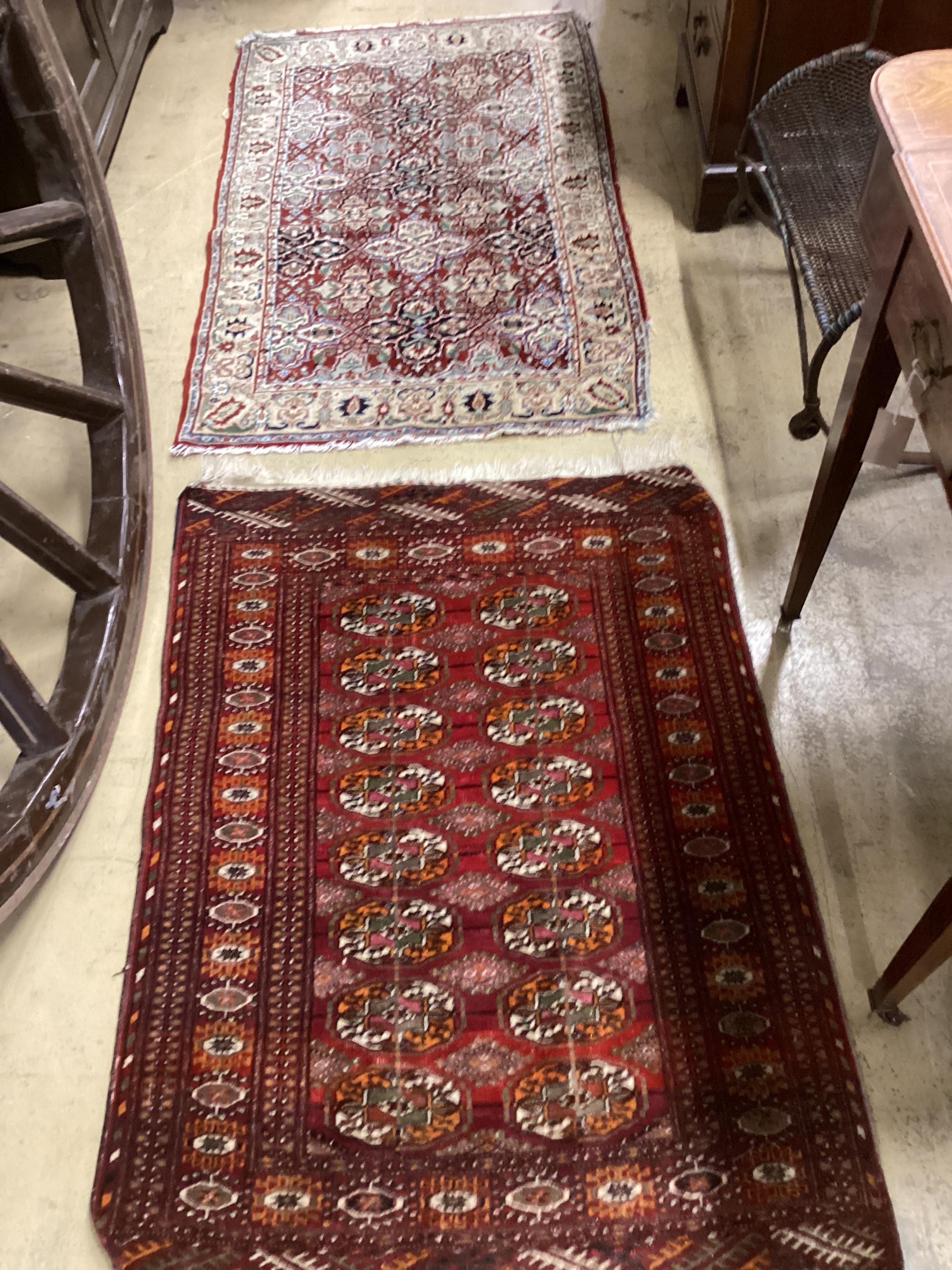 A North West Persian rug and a Bokhara rug, larger 114 x 84cm